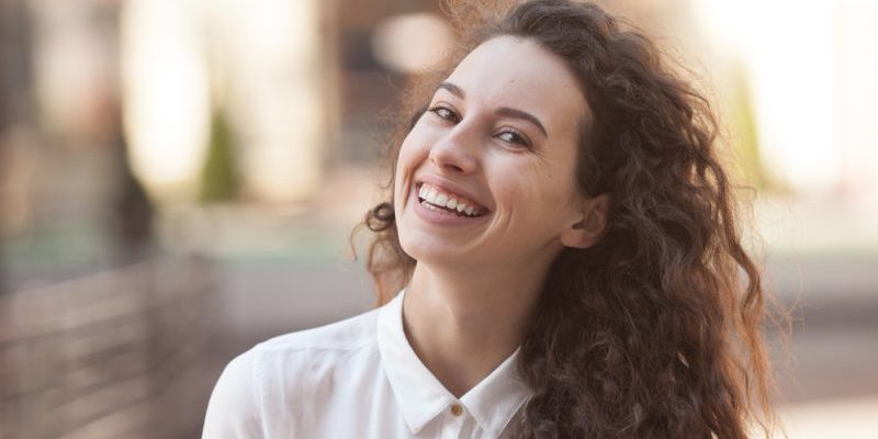 Happiness,Concept,-,Happy,Woman,Having,Fun,On,City,Street restorative dentist auburn