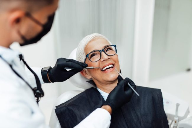 Beautiful,Senior,Woman,Having,Dental,Treatment,At,Dentist’s,Office.,Dentist restorative dentist auburn