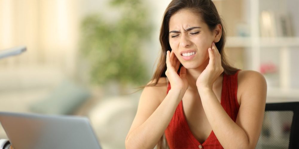 Stressed,Student,Suffering,Temporomandibular,Ache,At,Home emergency dentist near auburn